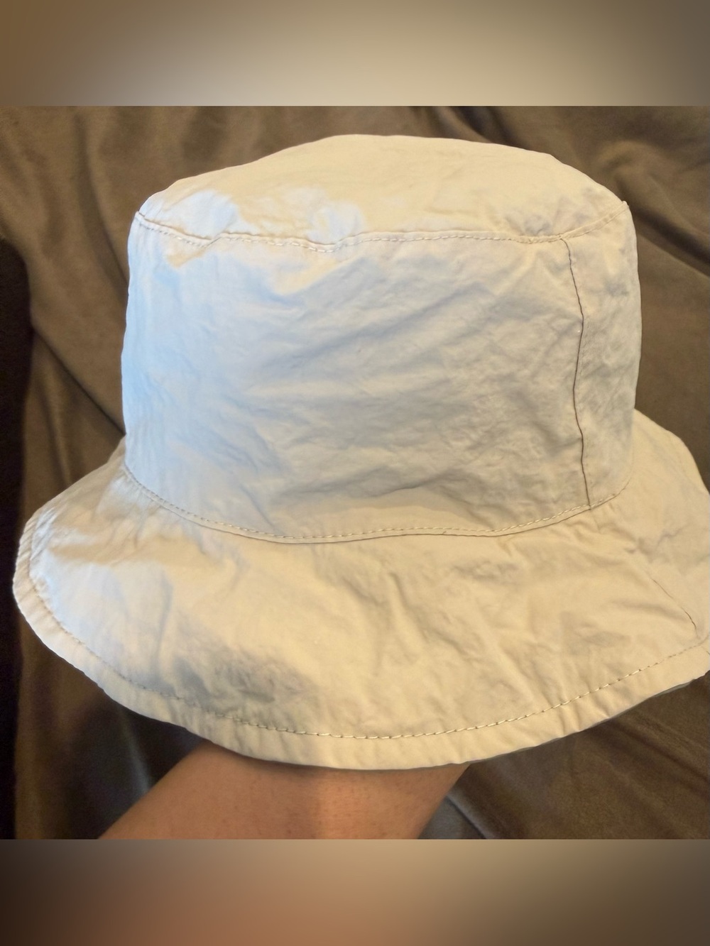 Toddler Classic Lightweight reversible Bucket Hat in cream & light olive green.